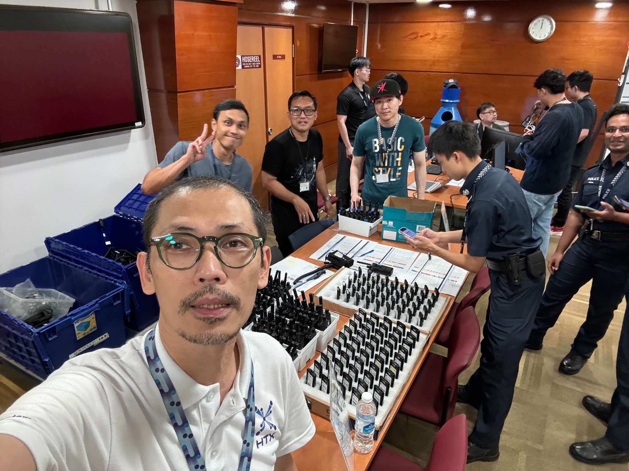 Engineer A.M. Azhar (in front) supporting SPF officers at NDP 25