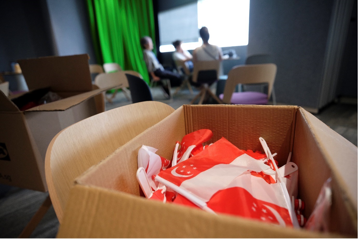 HTX Internal Communications and Engagement team (pictured in the background) from the Strategic Communications division comes together to brainstorm ideas 