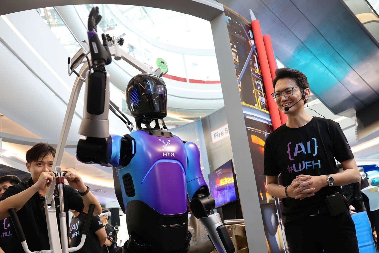 Two men with a robot