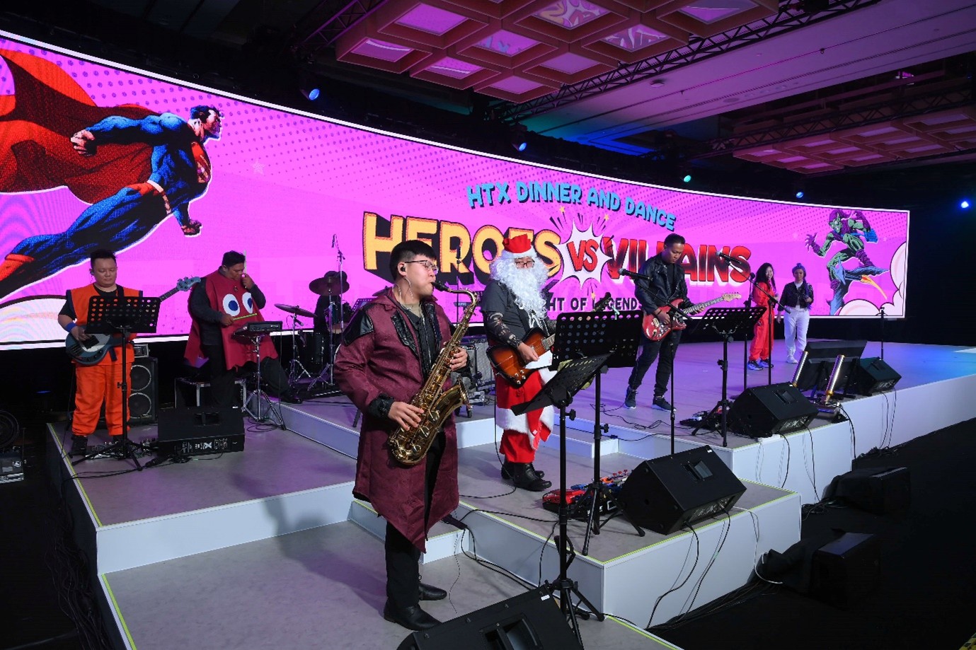 A group of people playing instruments on stage.