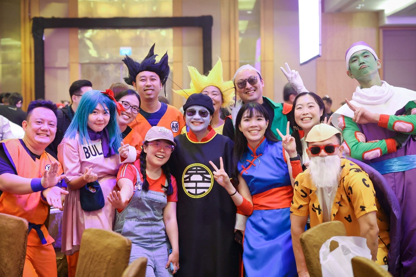 A group of people in colourful costumes and wigs.