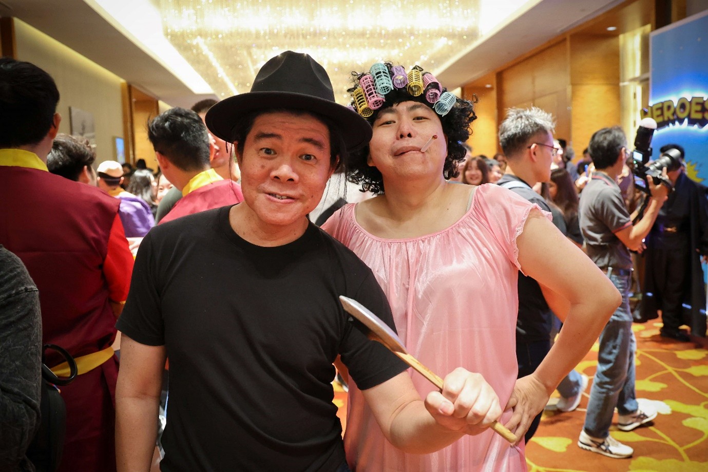 A group of people posing for a photo in colourful costumes.