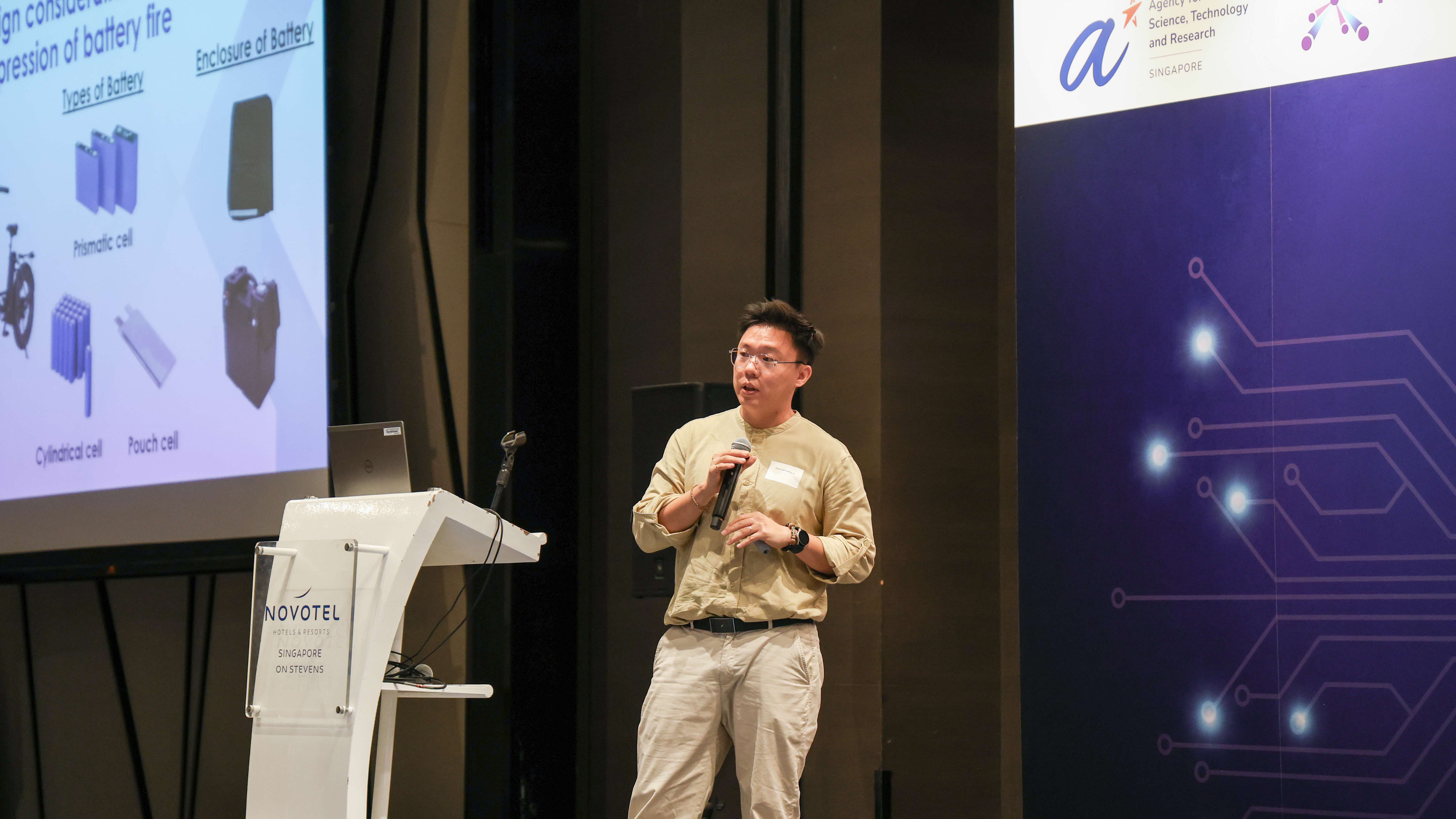 A man speaking in front of an audience.
