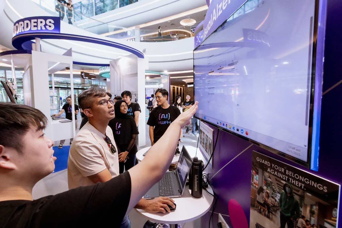 People engage with VisualAlzer at the demo booth.