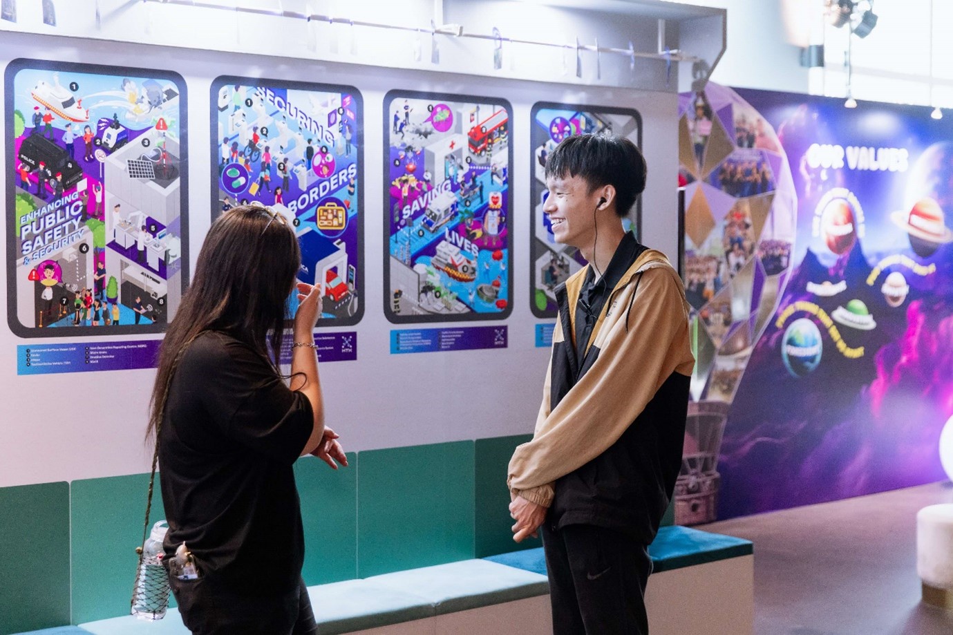 People standing at an exhibition.