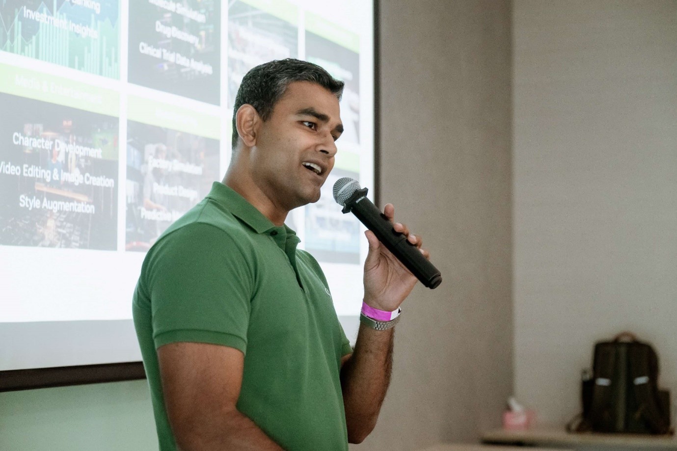 A man standing with a microphone.