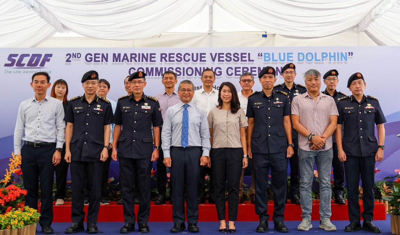 Group of people standing on stage.