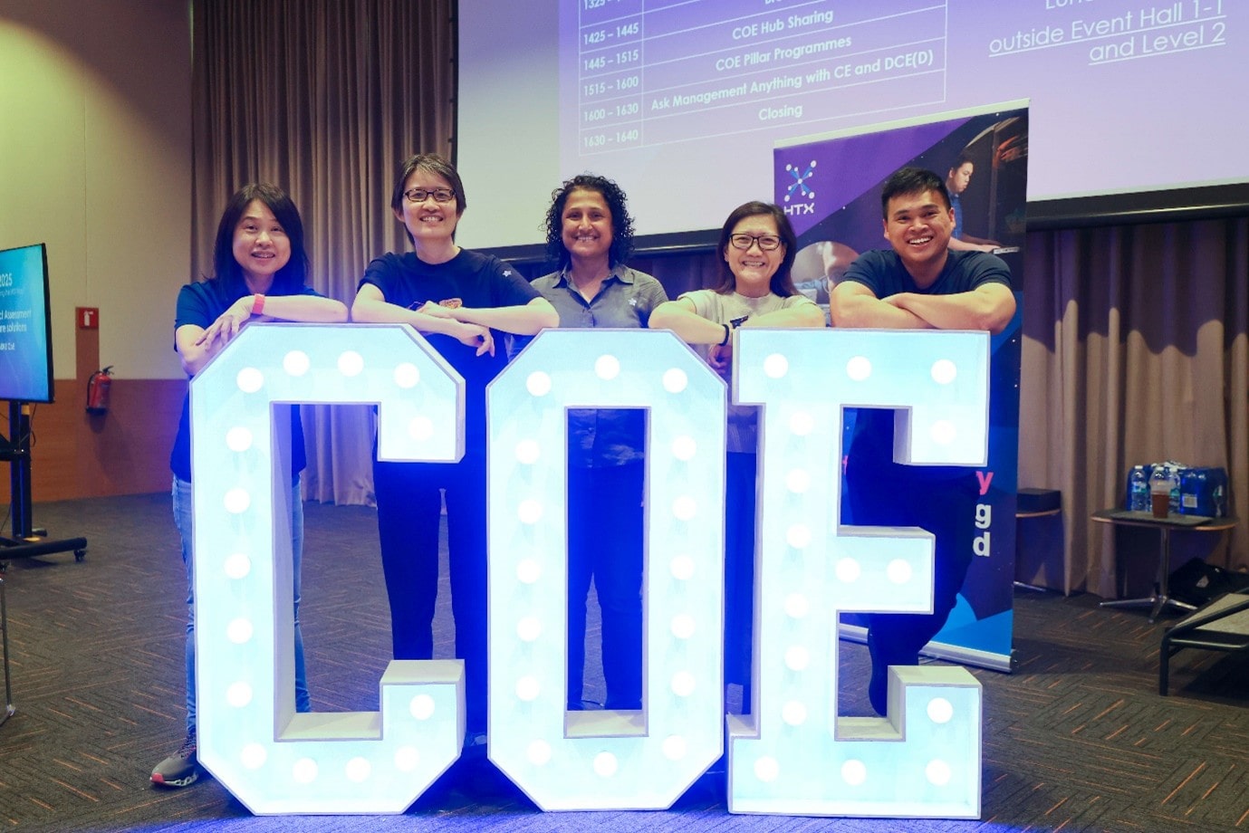 People standing in front of display