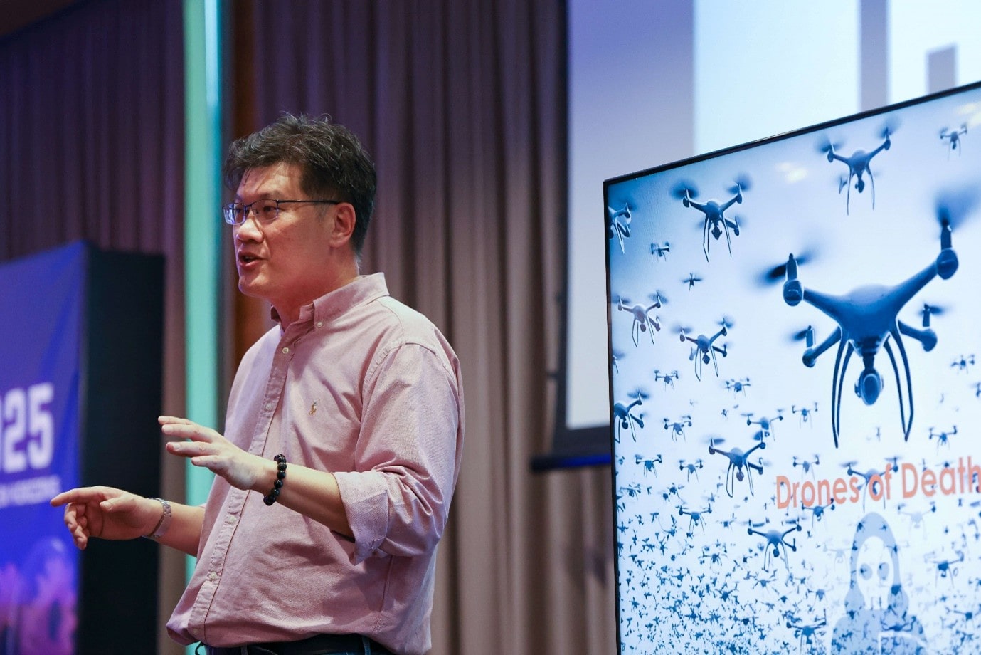 Man on stage talking