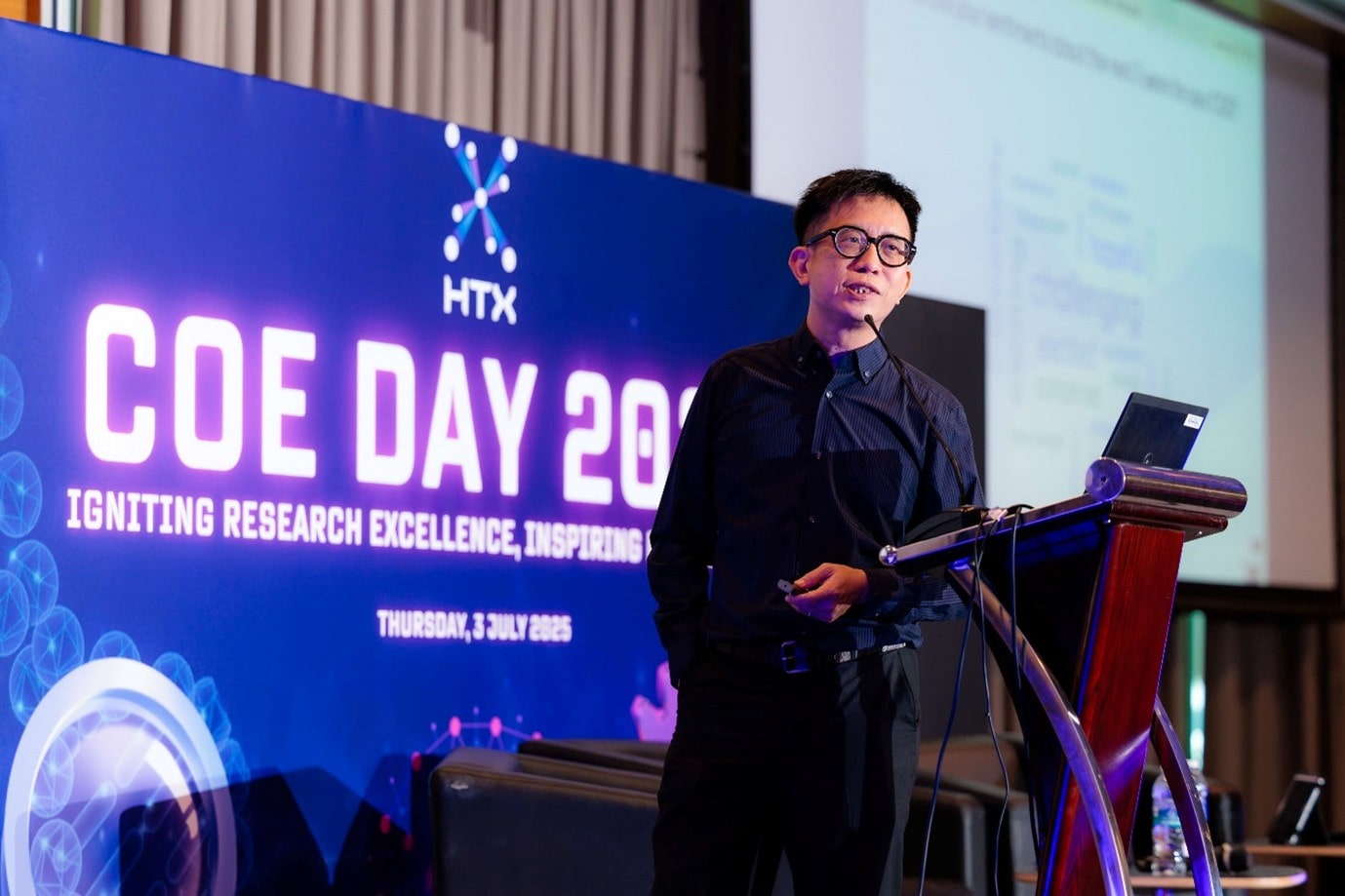 Man on stage talking