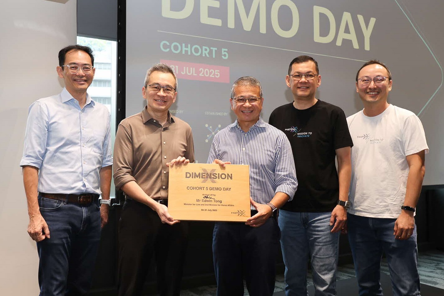 Two men holding a sign.