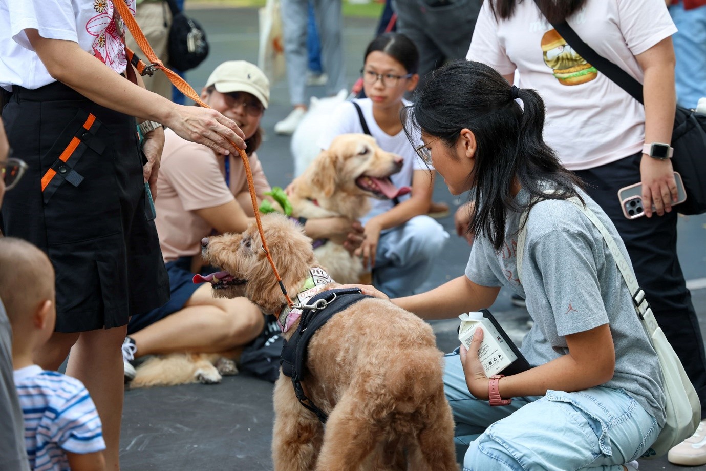 Xponents with their family members and pets at HTX Family Day 2025.