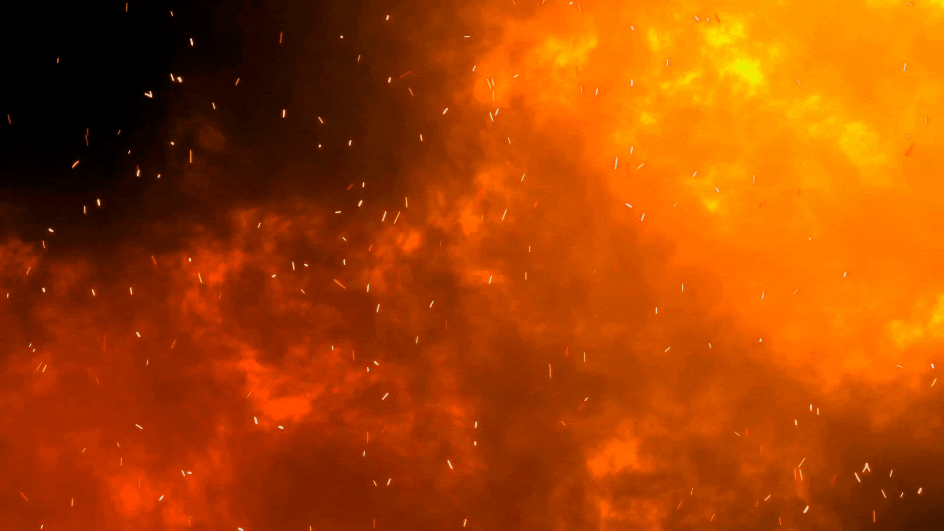Fire, smoke and embers in the air.