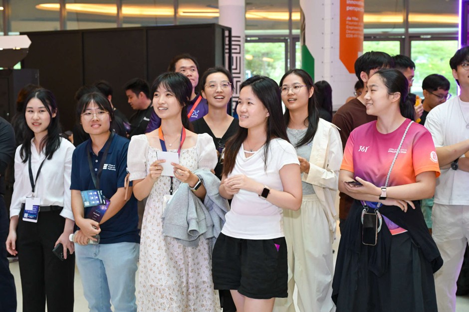 A group of people smiling and engaged.