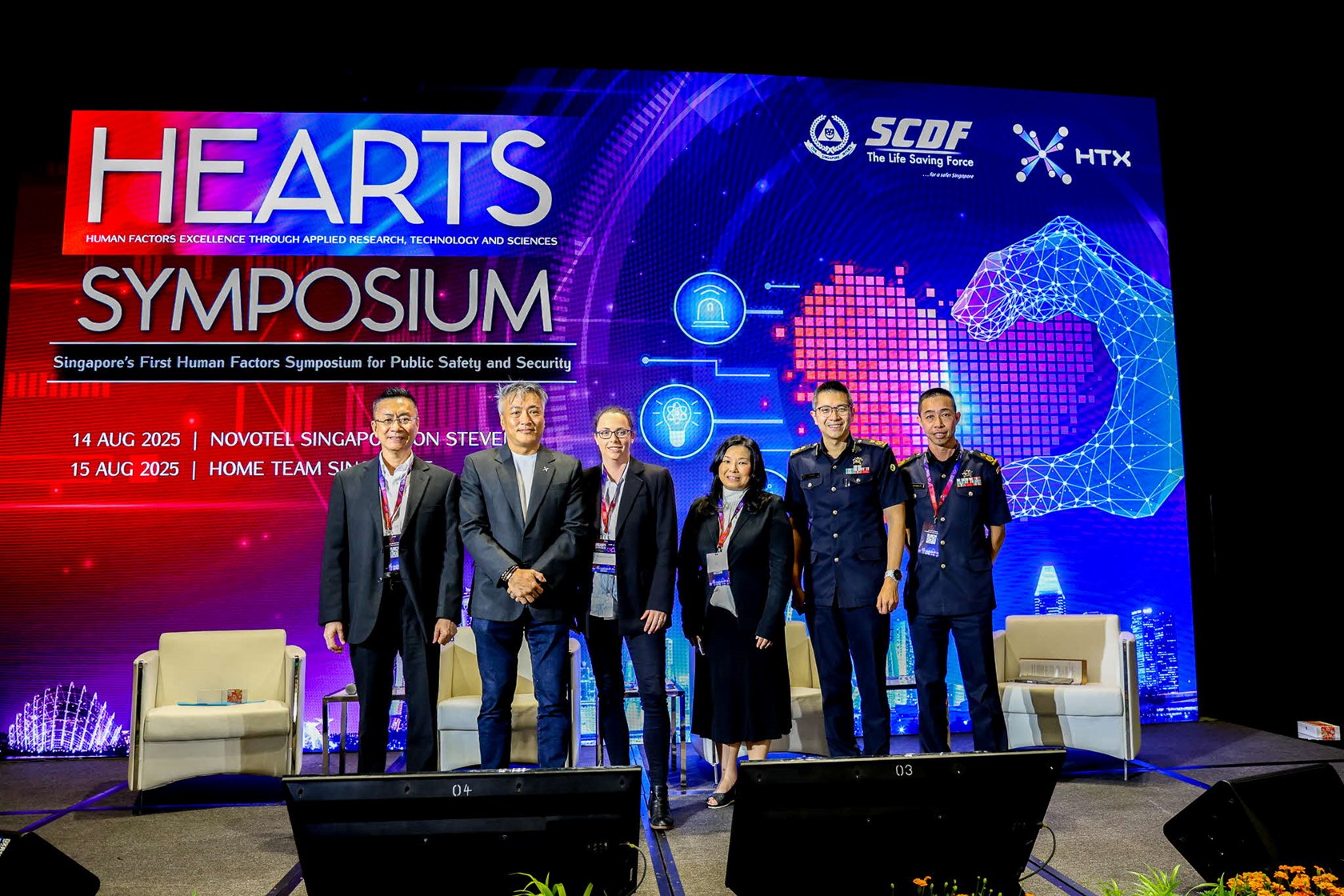 A group of people standing on a stage.