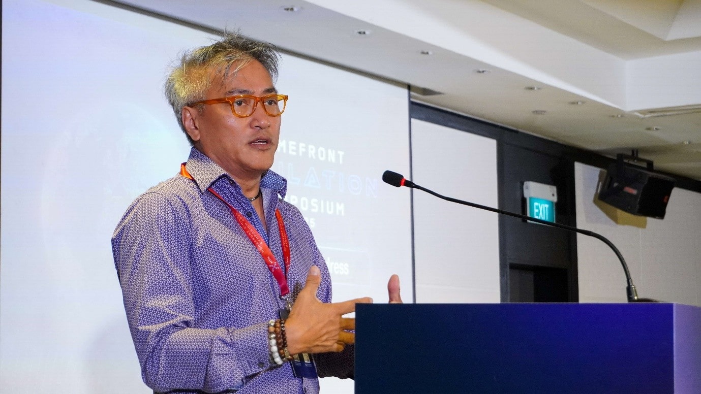 A man speaking at a podium.