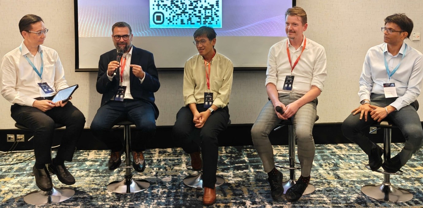 A group of men sitting on chairs.