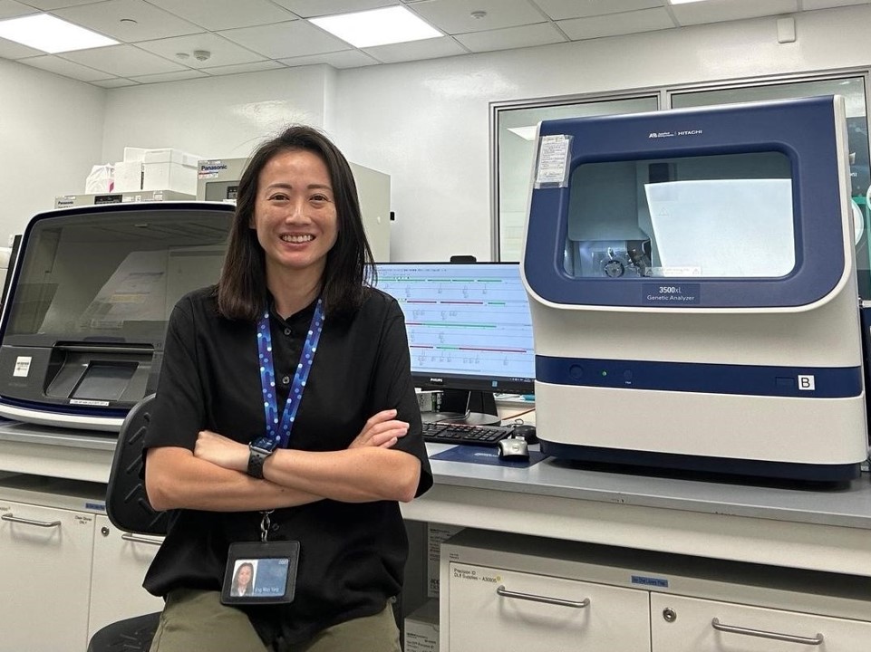 A woman posing for a photo.