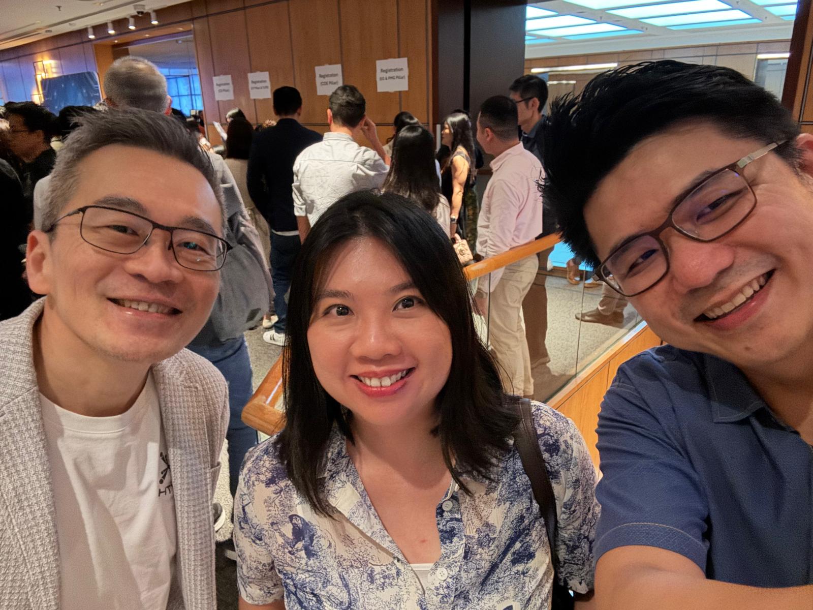 Three people posing.