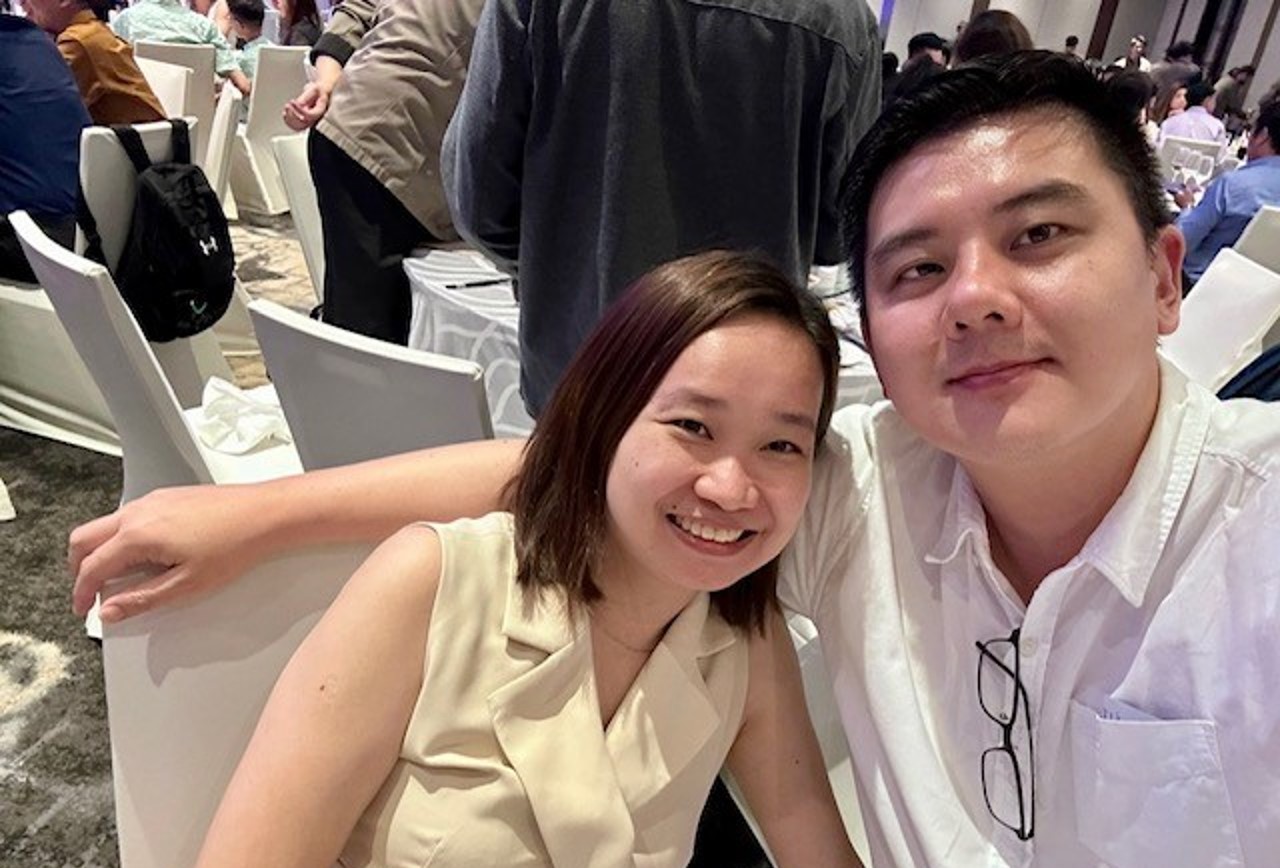 Two people posing.