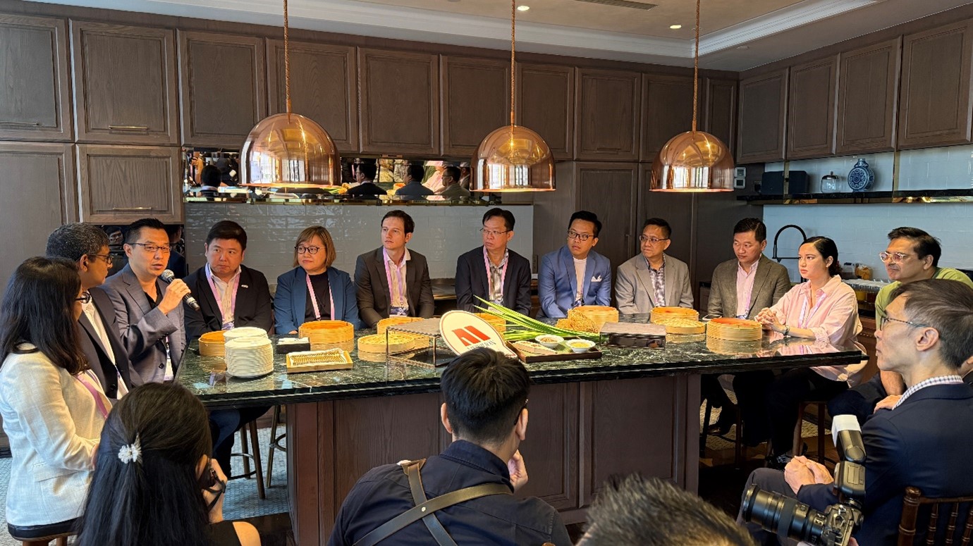 A group of people sitting around a table.
