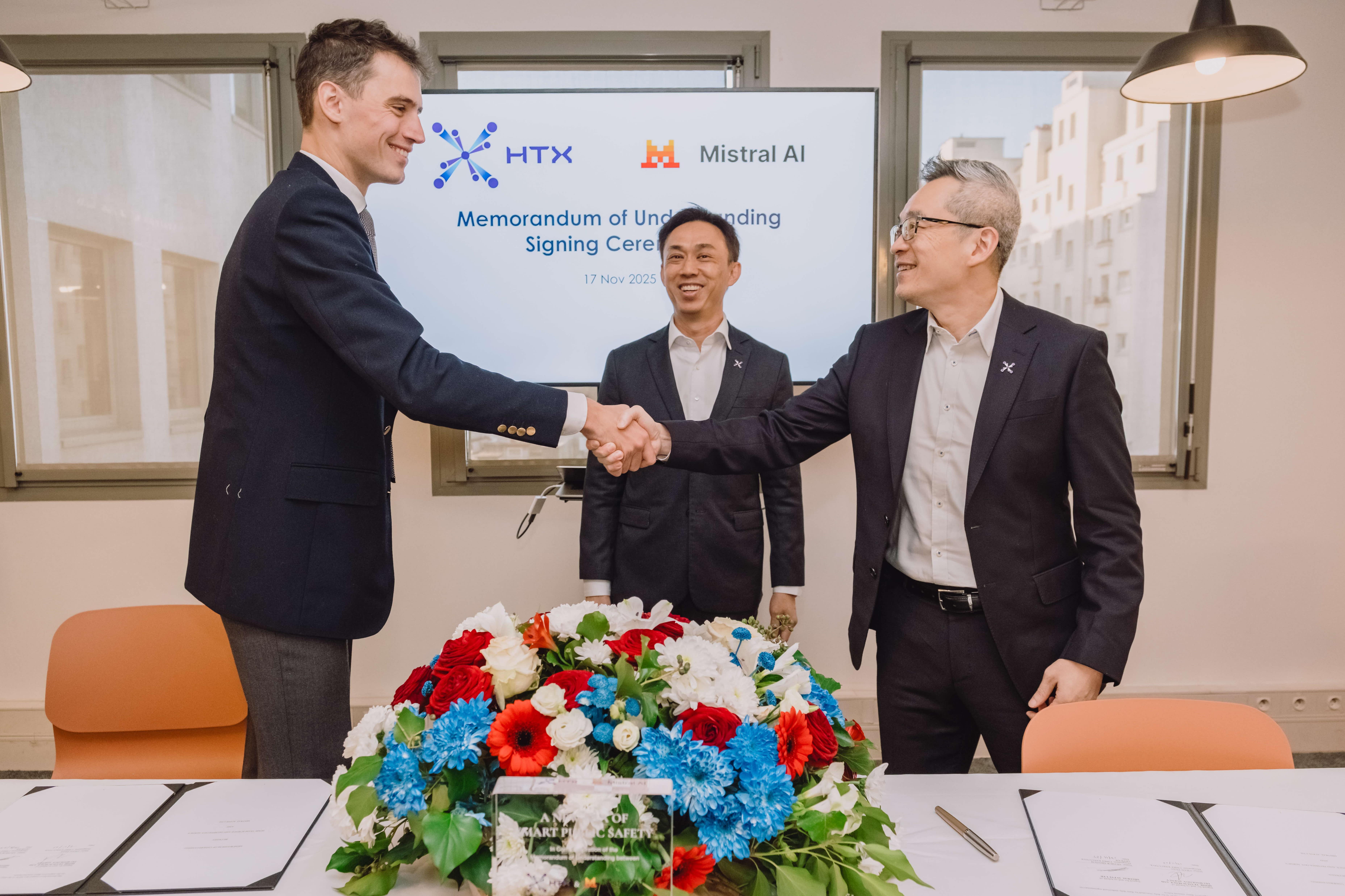 A group of men shaking hands.