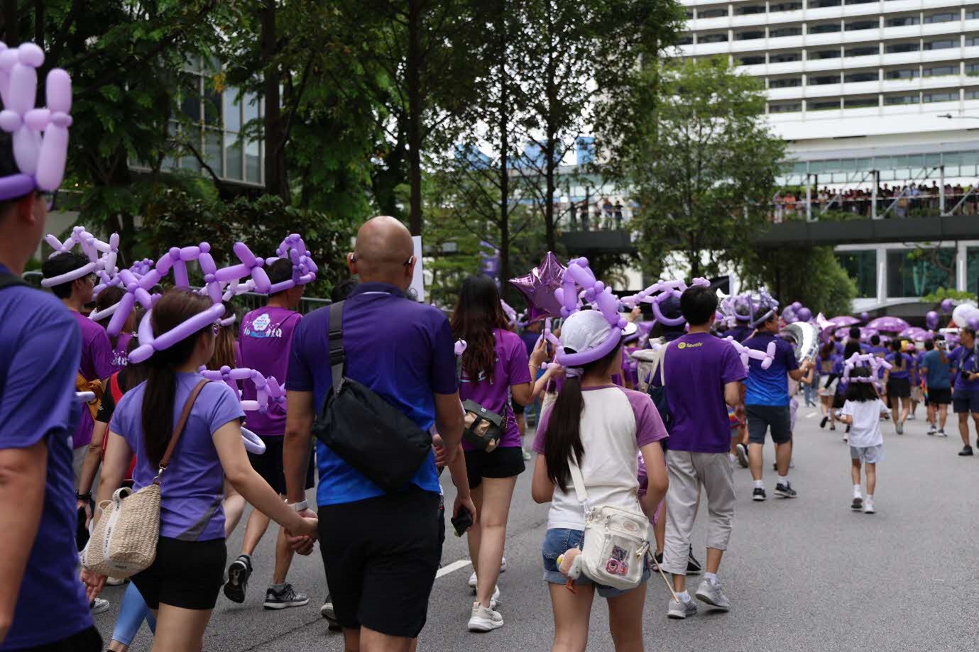 A group of people walking on the street.
