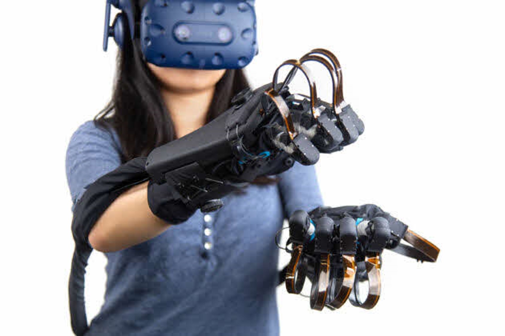 Woman using haptic gloves.