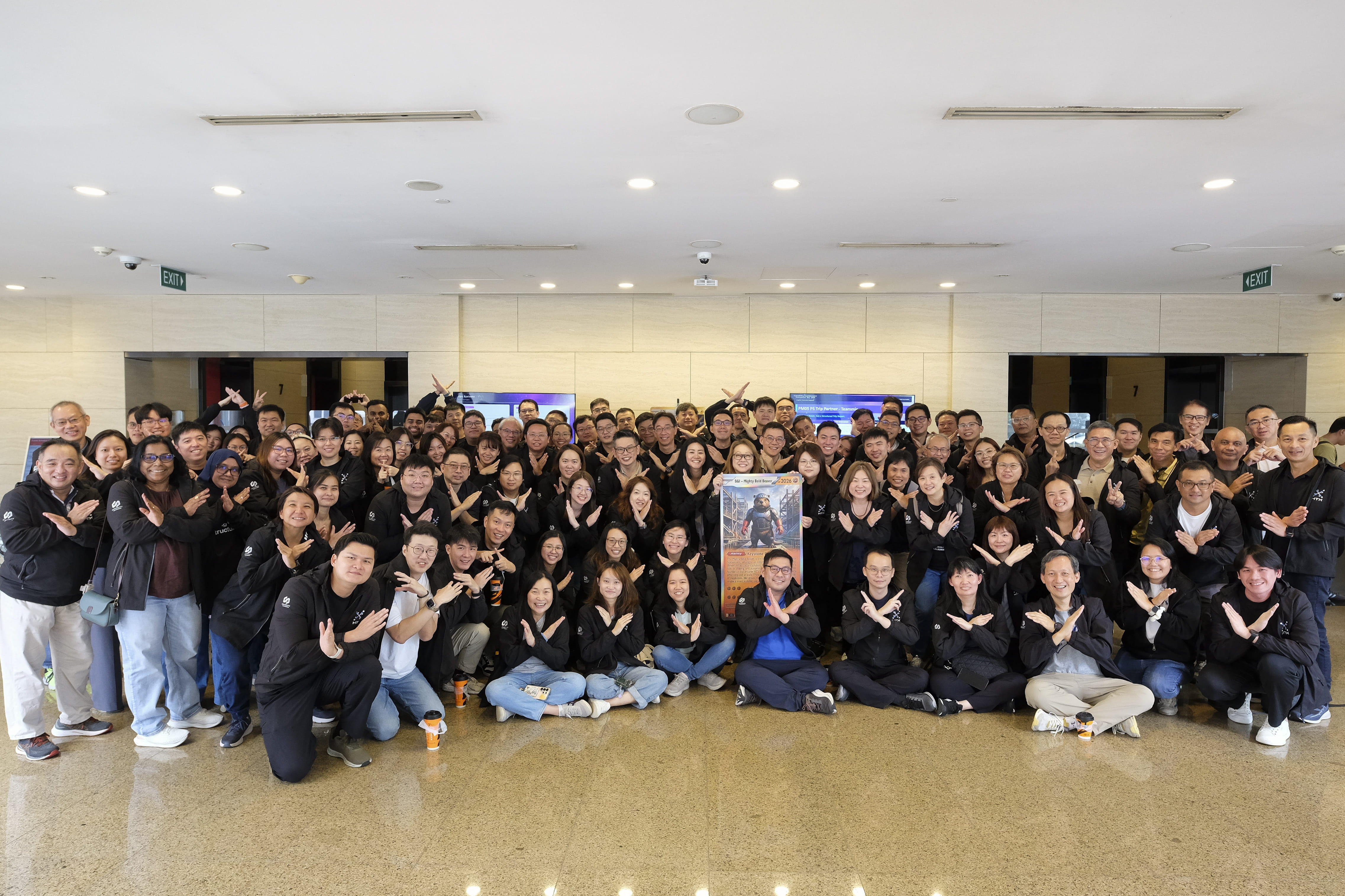 Large group of people posing together indoors.