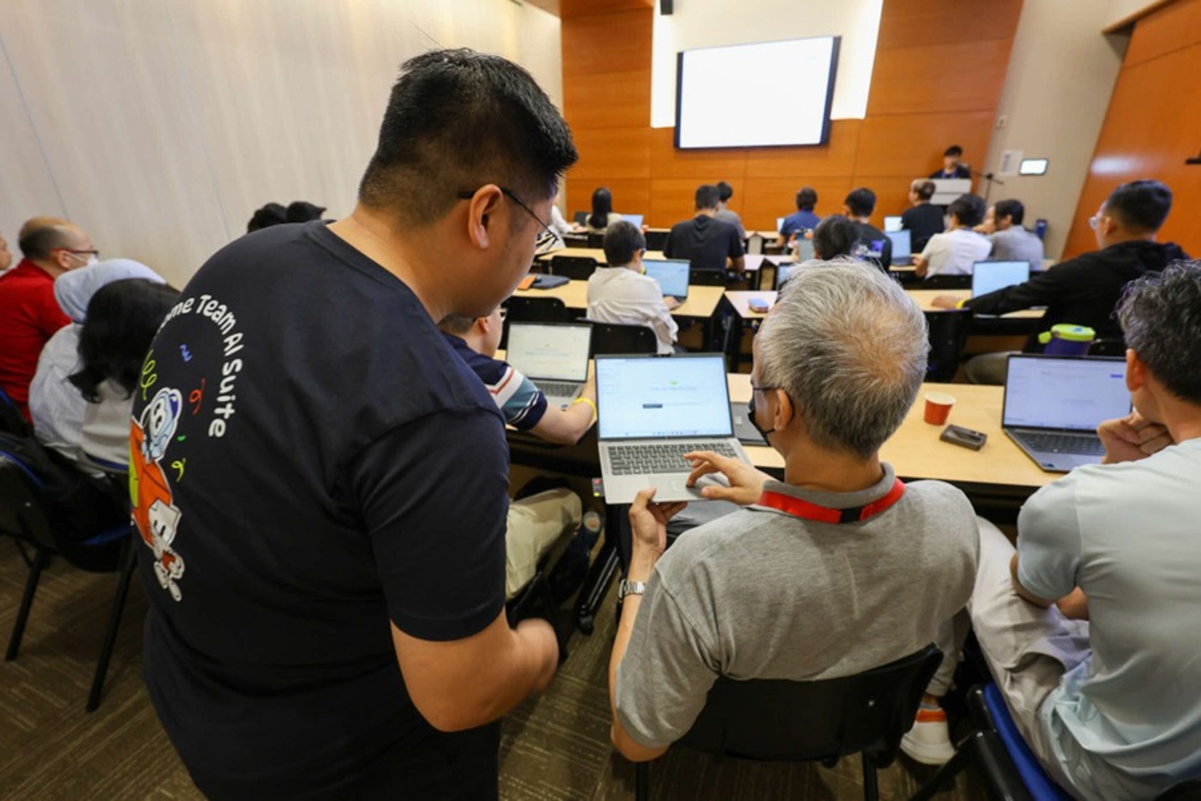A group of people in a classroom.