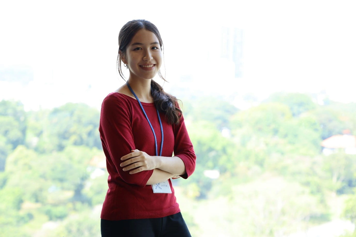 A young woman smiling and posing for a photo.