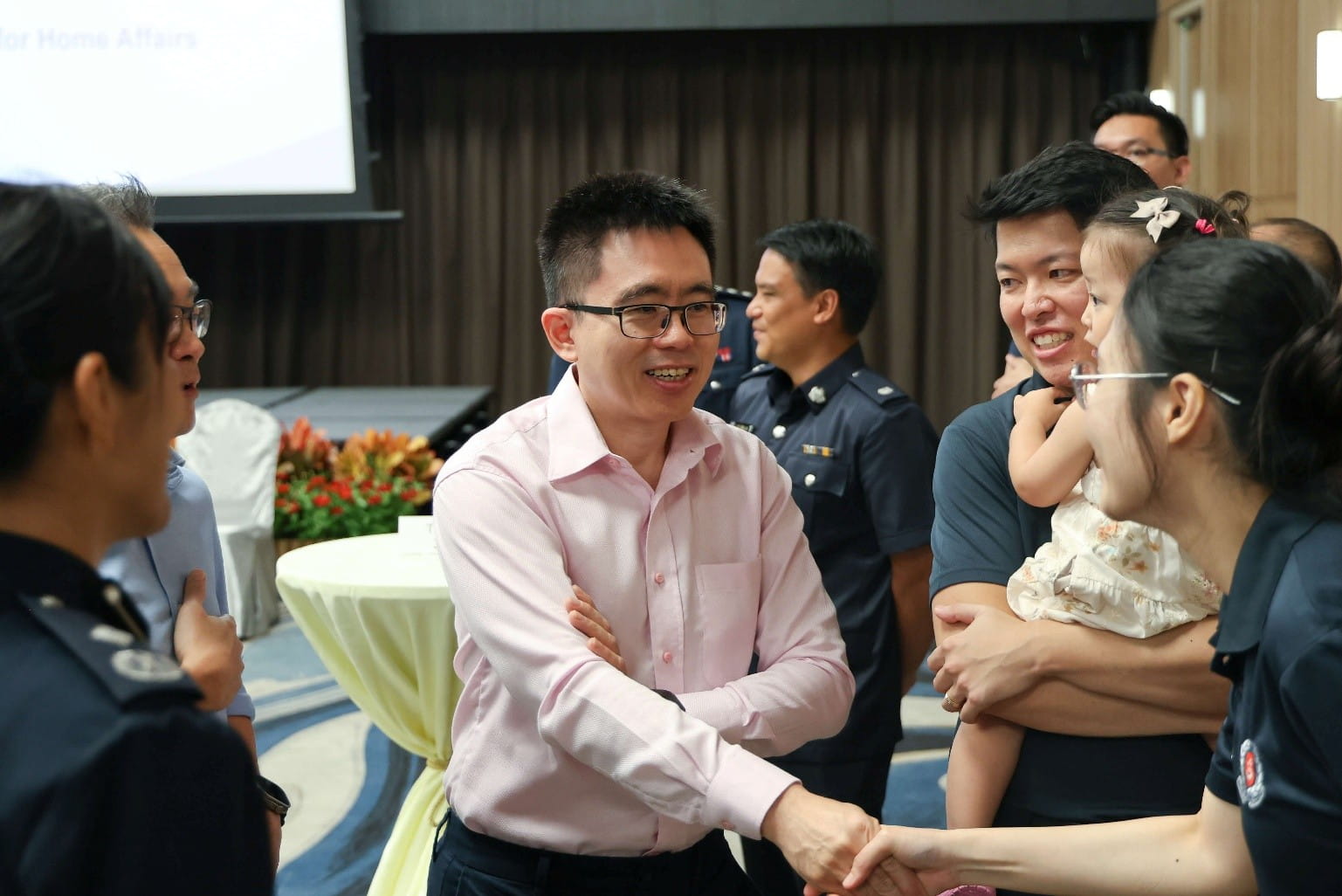 Man shaking hands with a woman.