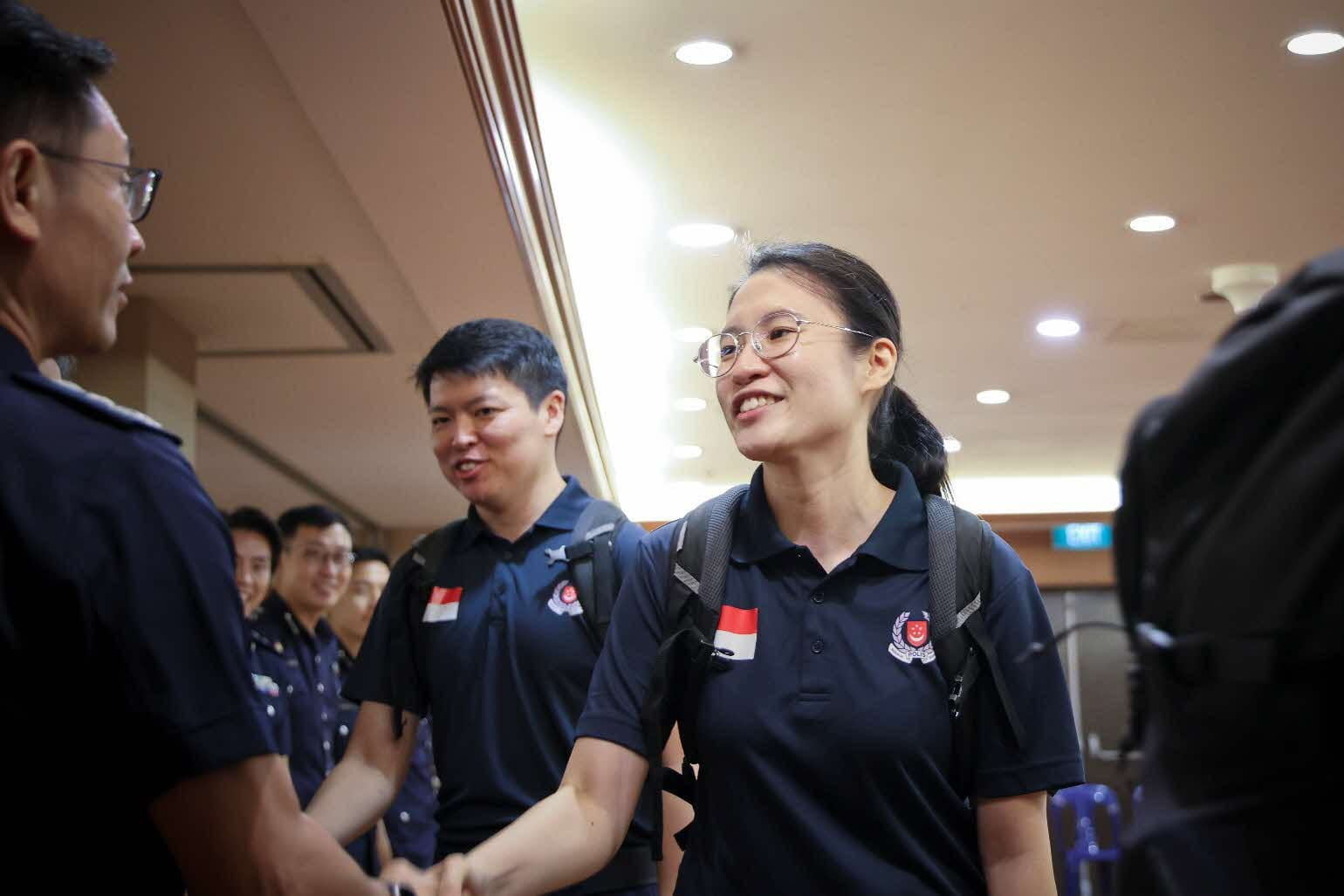 Woman shaking hands with a man.