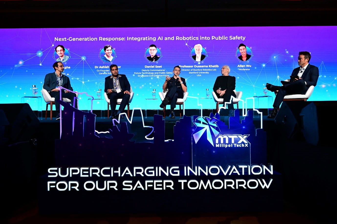 Group of people on stage for a panel discussion.