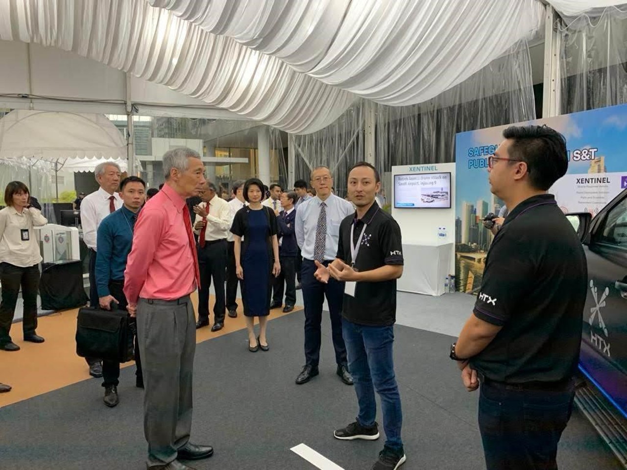 Group of people at a tech exhibition.