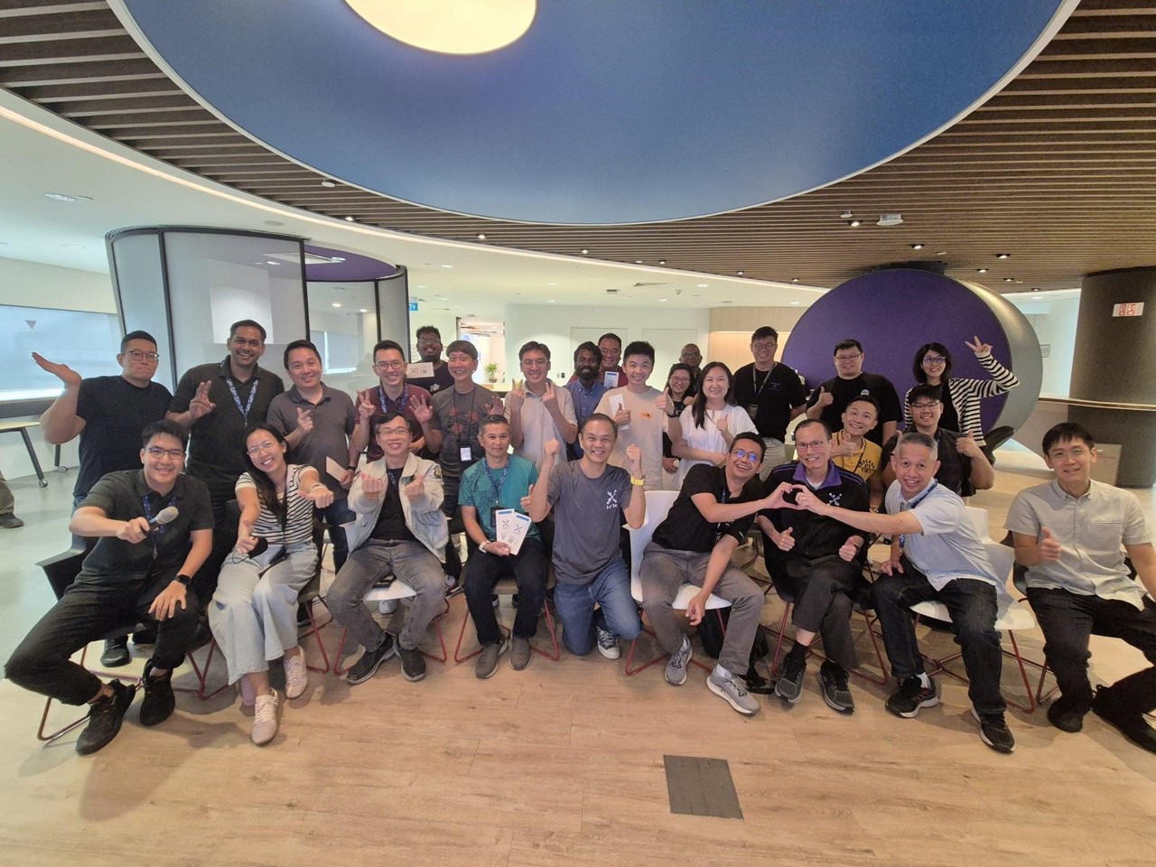 A group of men and women posing.