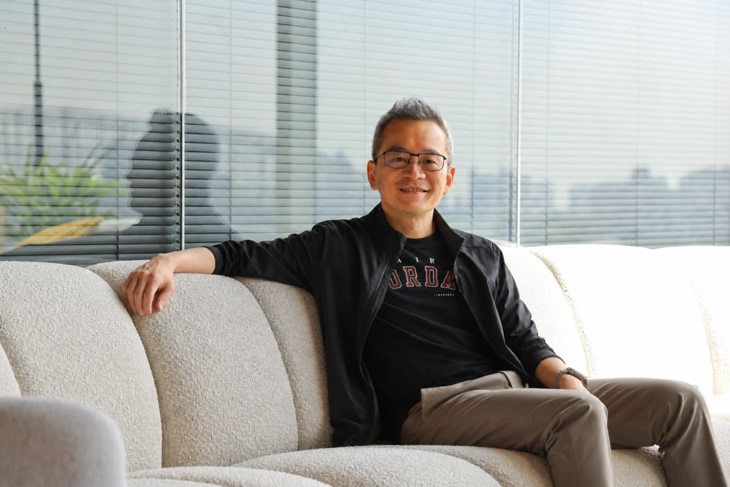 Man sitting on a sofa.