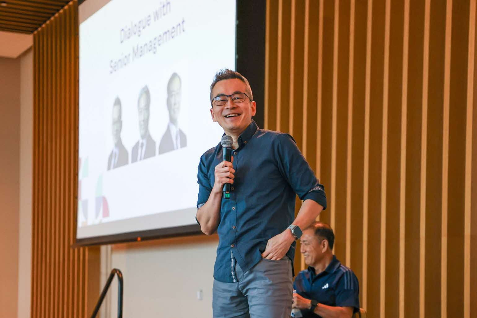 Man holding a microphone.