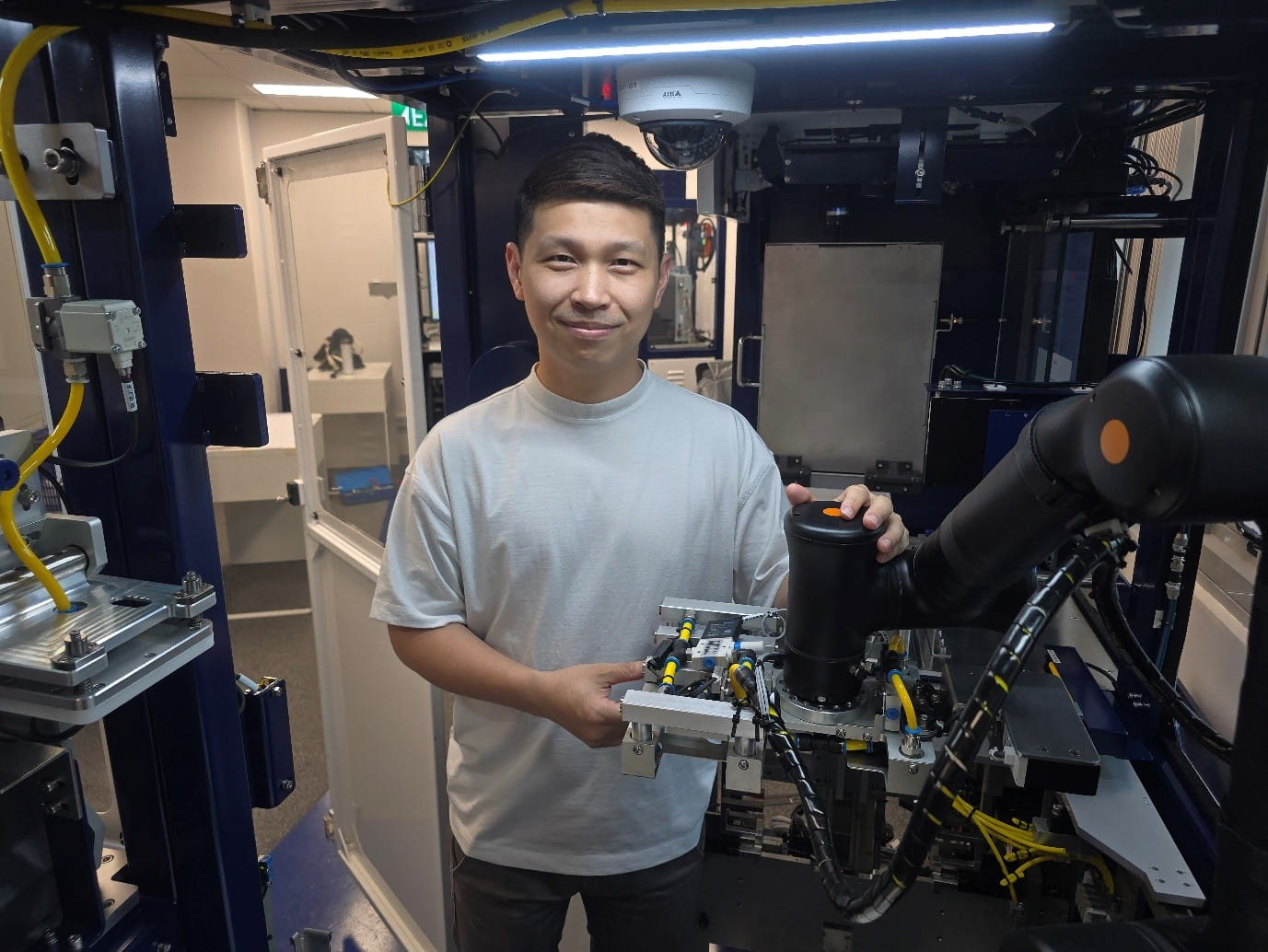 Man operating an automated solution, surrounded by machinery and equipment.
